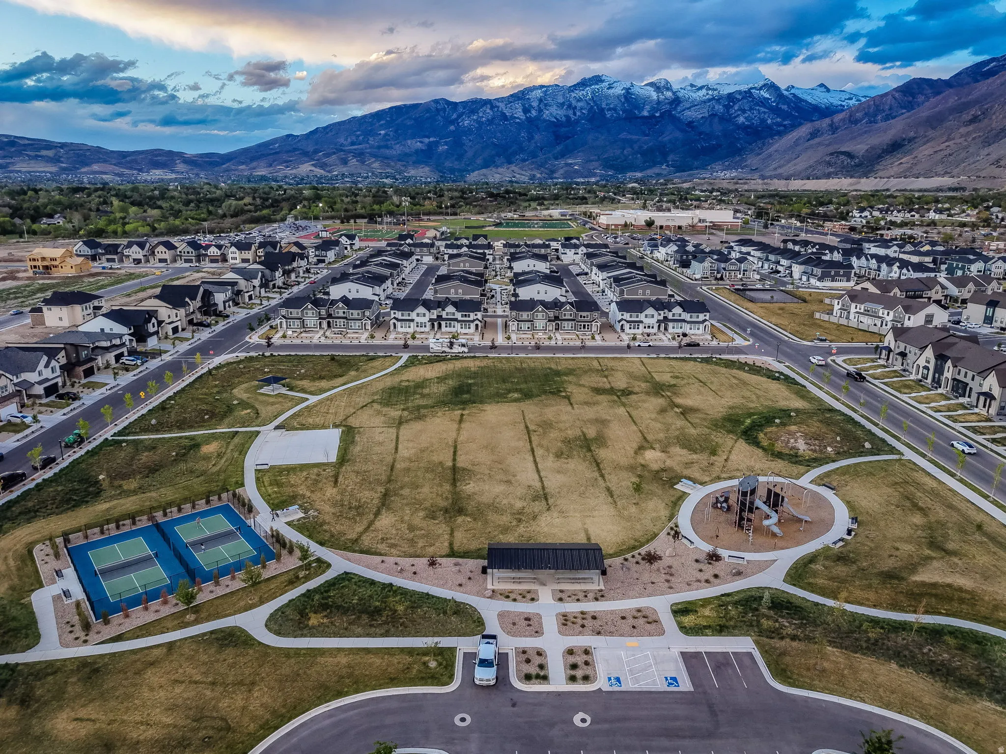 Aerial overview of property's location with mountains and nearby suburban area