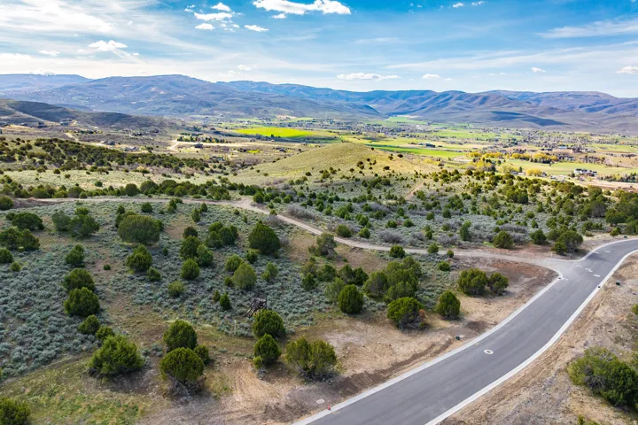 Overview of rural landscape featuring a mountain backdrop