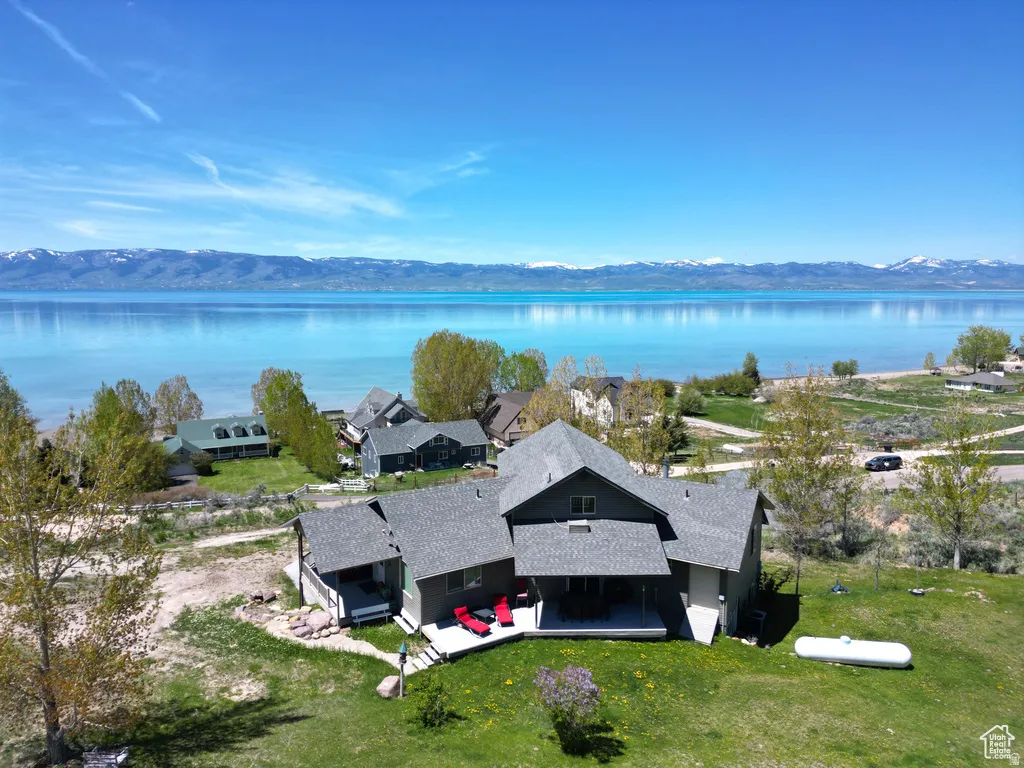 View of subject property featuring a water and mountain view