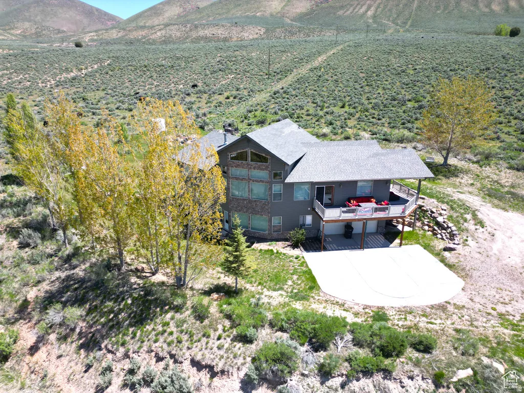 Aerial view of sparsely populated area featuring a mountainous background