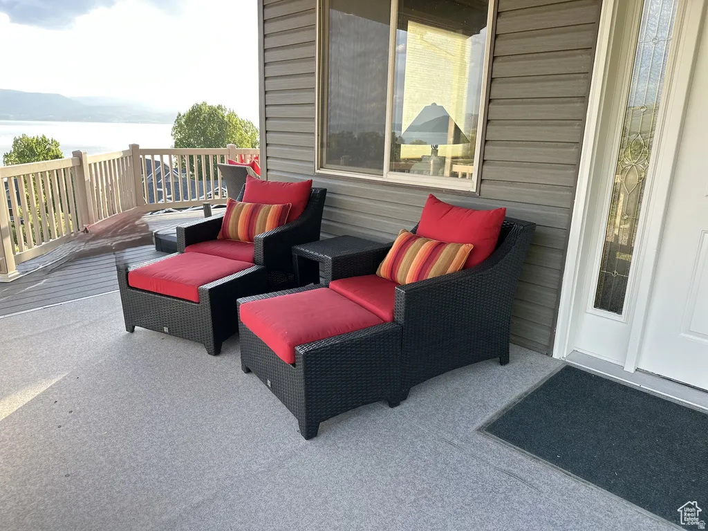 View of patio / terrace featuring a deck with water view