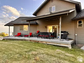 Rear view of property featuring a lawn