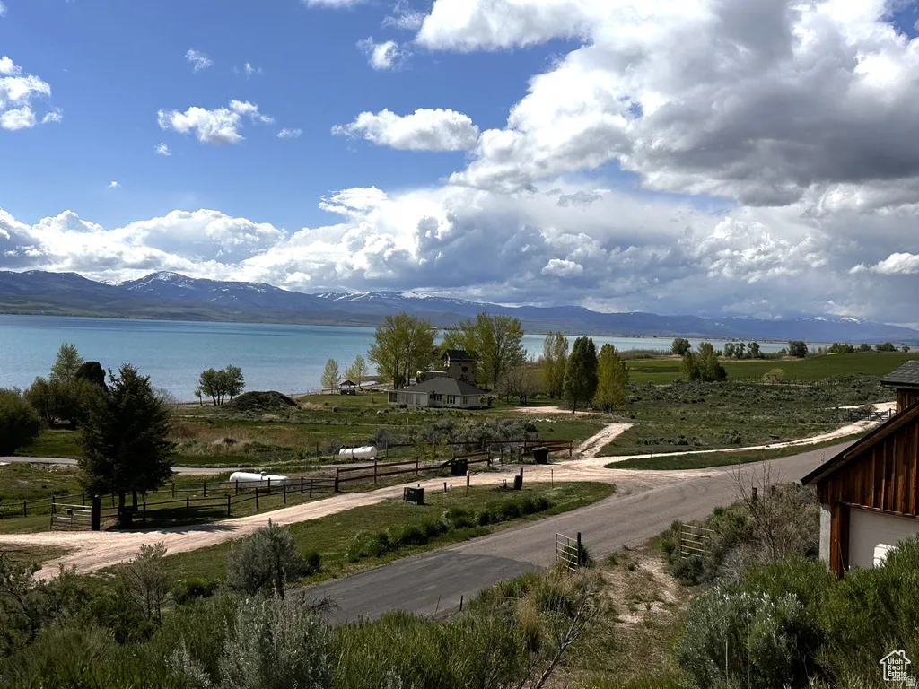 Water view with a mountainous background and rural landscape