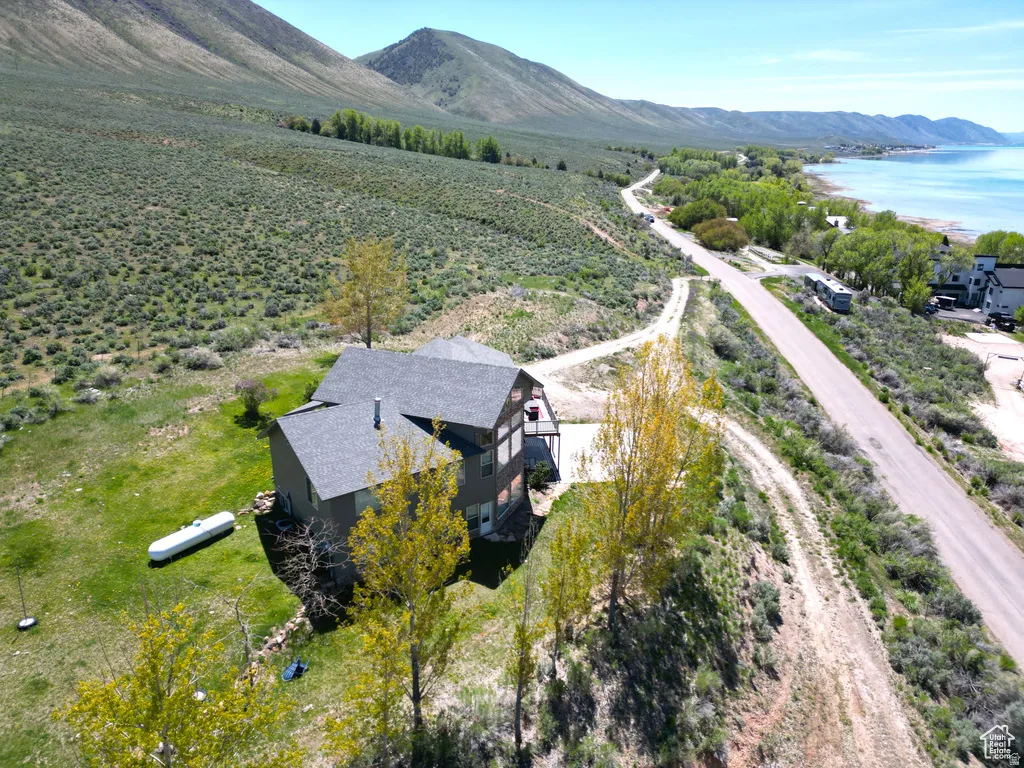 Aerial view of sparsely populated area featuring a mountain backdrop