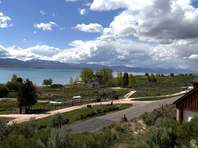 Water view with a mountainous background and rural landscape