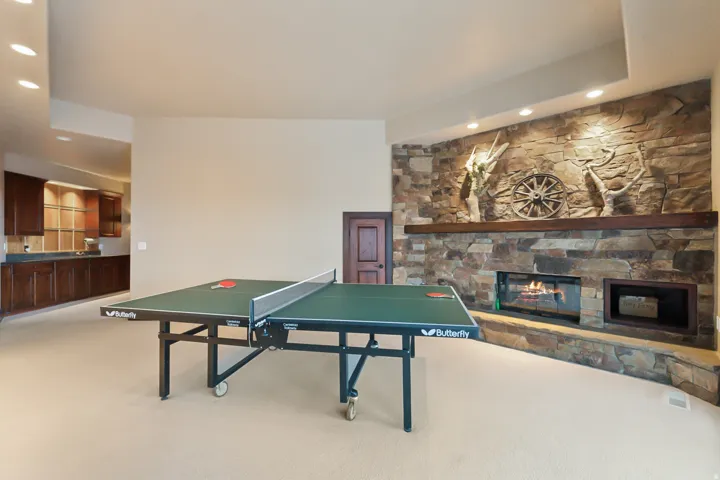 Ping Pong / Rec room featuring secret kids room door in background.