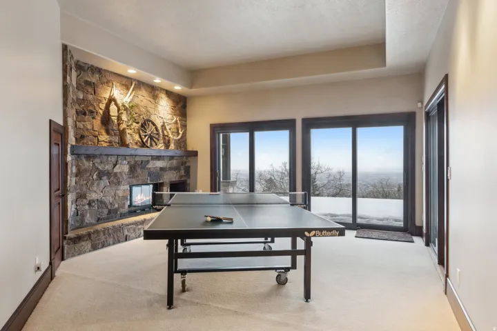 Ping Pong room downstairs adjacent to pool room with gas fireplace.