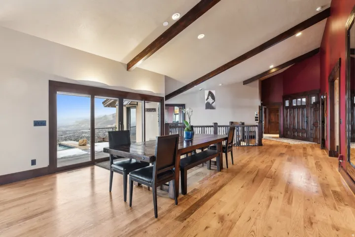 Dining area with mtn views, indirect lighting, & 5" wide, 3/4" thick solid oak wood floors throughout.