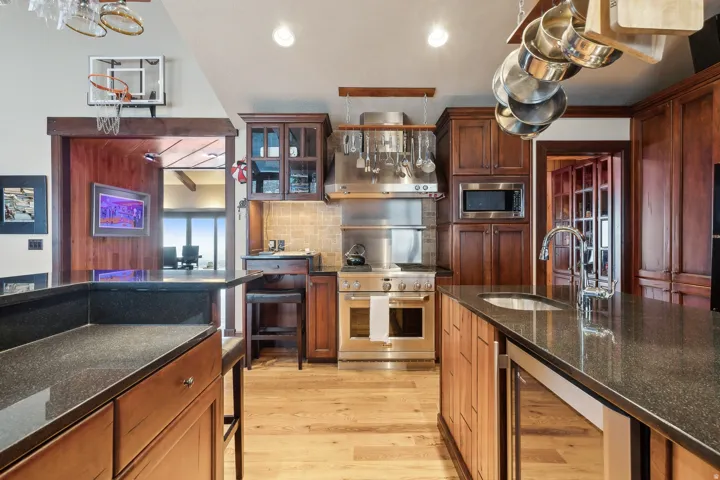 Kitchen showing all black granite countertops