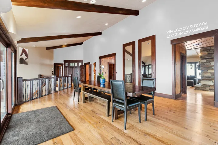 Dining area with light hardwood flooring, lofted ceiling, and recessed lighting