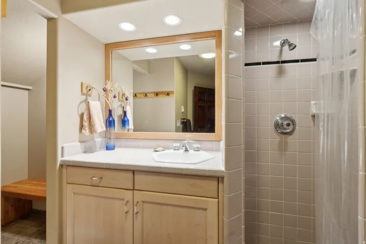 Bathroom featuring a shower stall and vanity