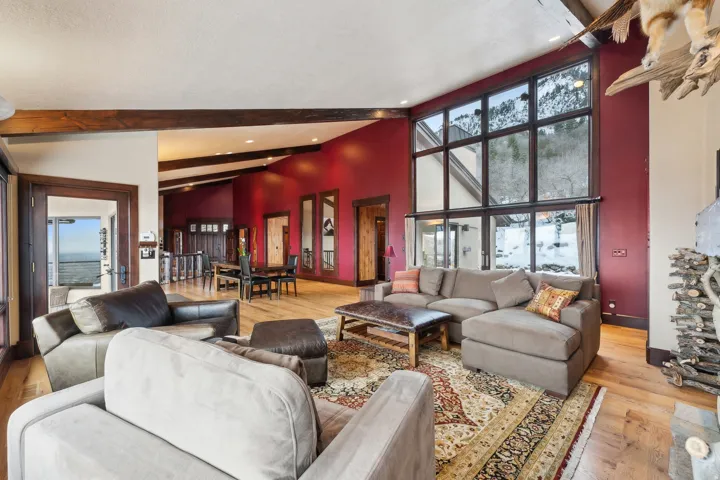 Living area featuring light hardwood flooring and lofted ceiling