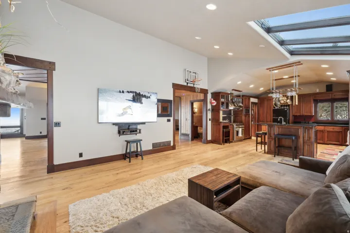 Family room showing arched kitchen ceiling in background.