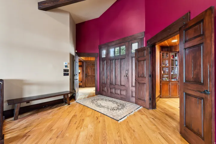 Entrance area with foyer in background, & pantry walk-thru on right.