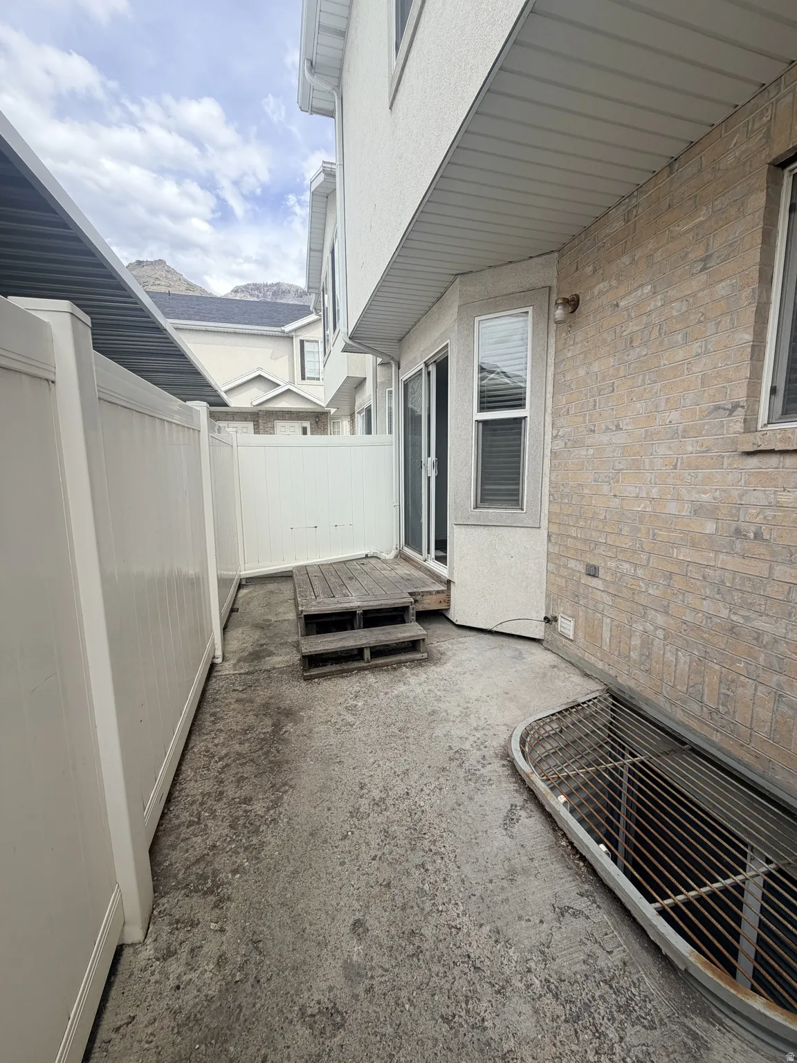 Fenced backyard with a deck