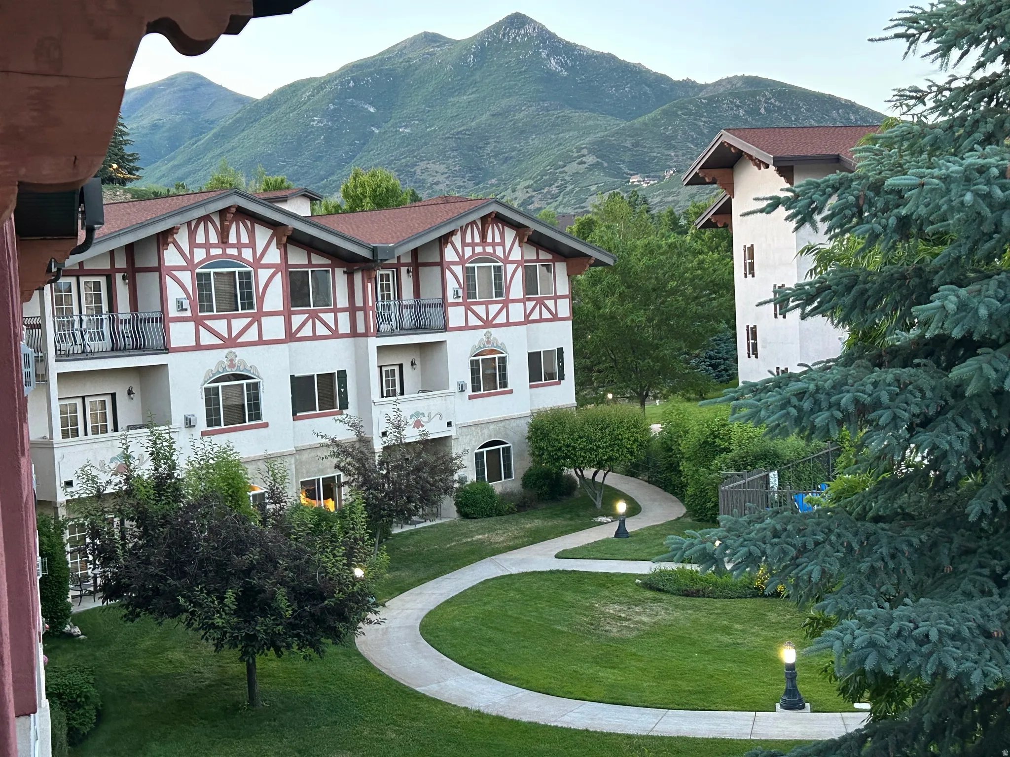 View of interior of the community featuring a mountain view and a balcony