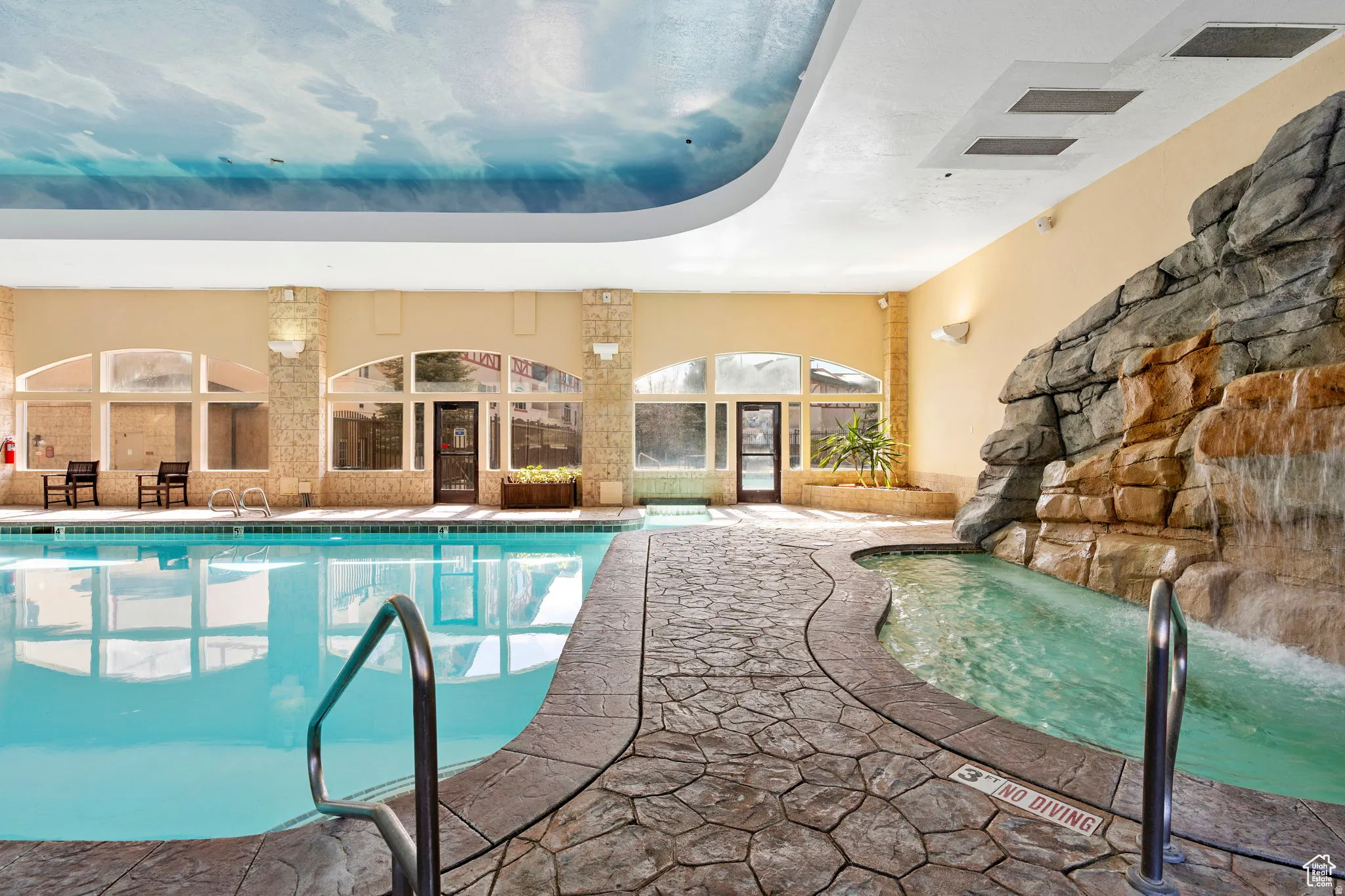 View of indoor pool and hot tub
