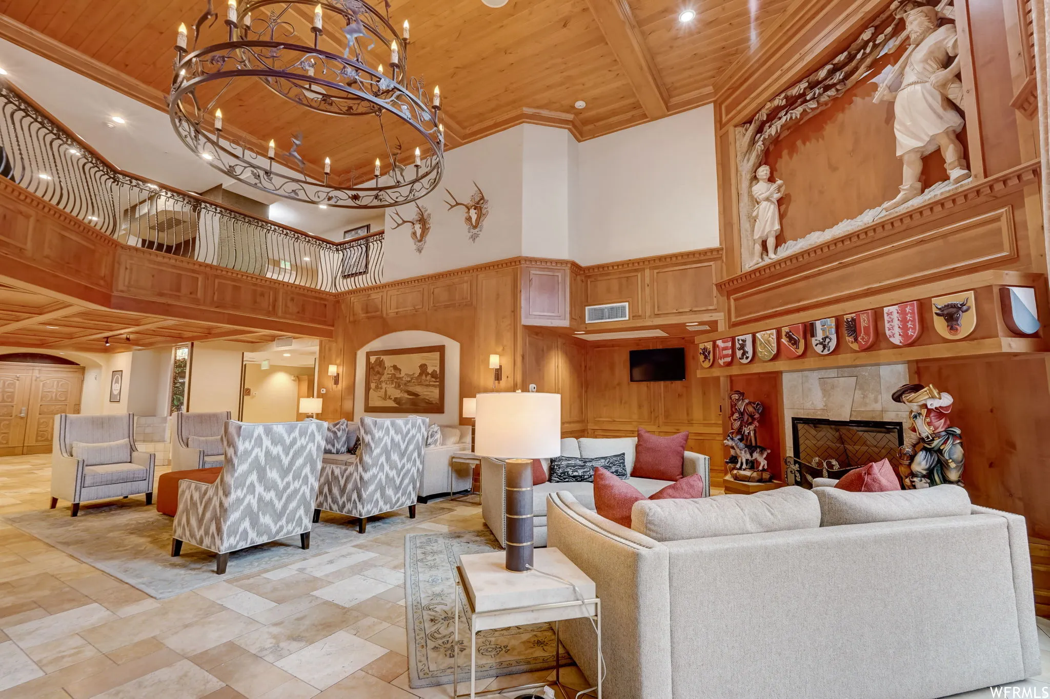 Common area featuring a high wood ceiling and wooden walls