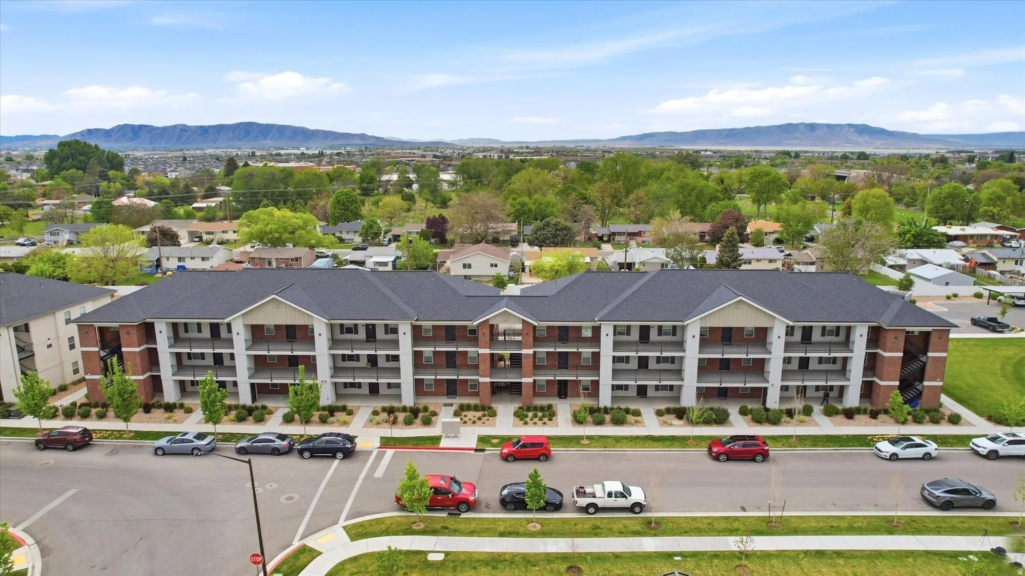Aerial perspective of suburban area with a mountainous background