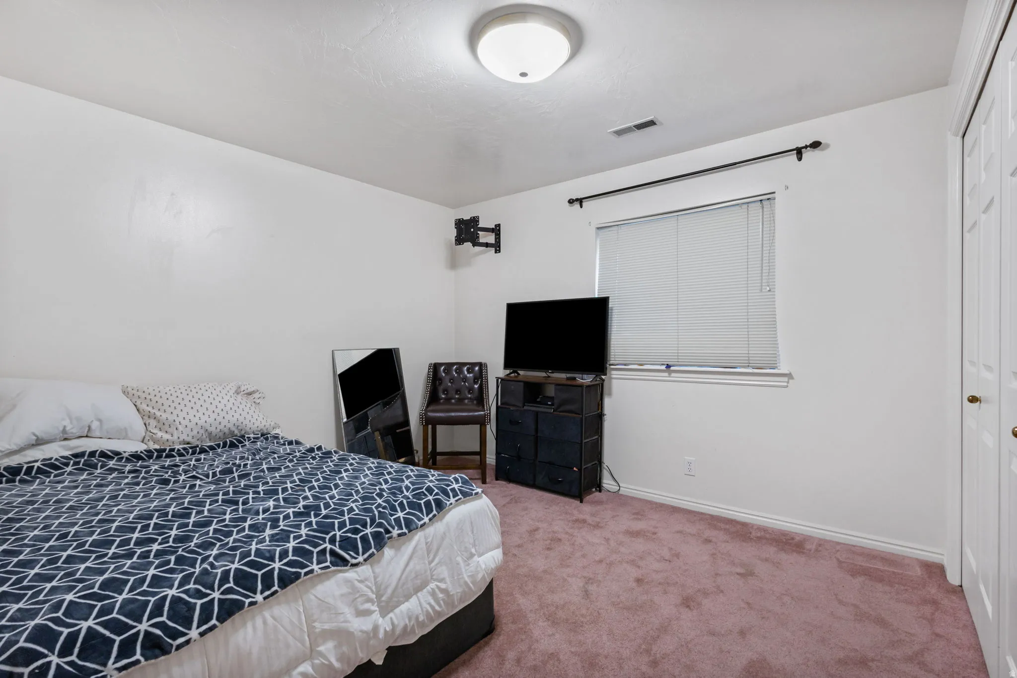 Bedroom with carpet and baseboards