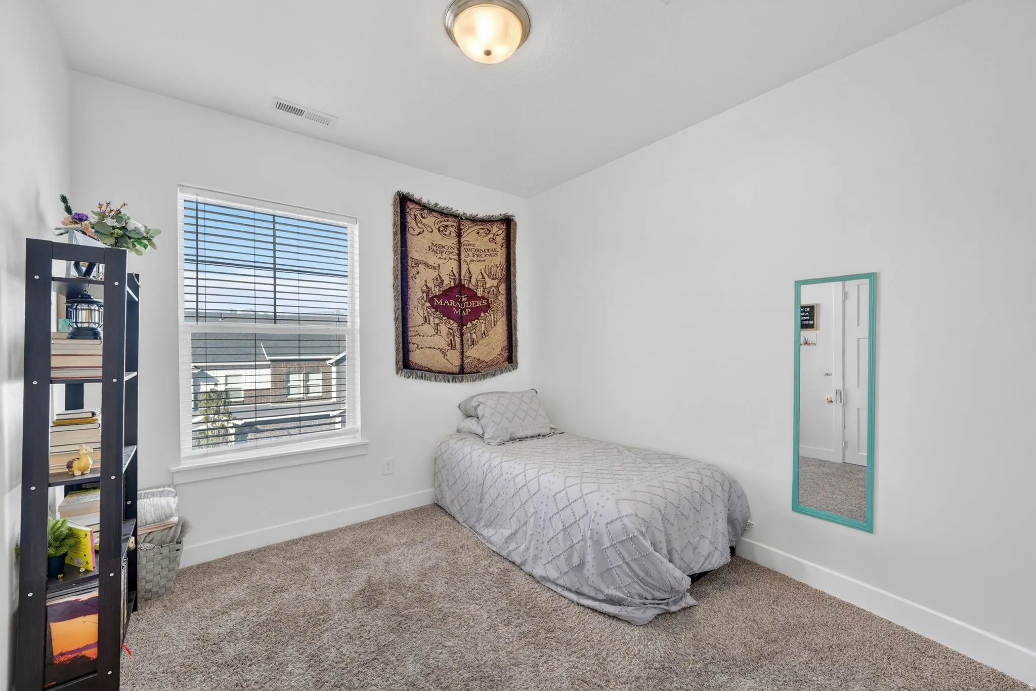 Bedroom with carpet and baseboards