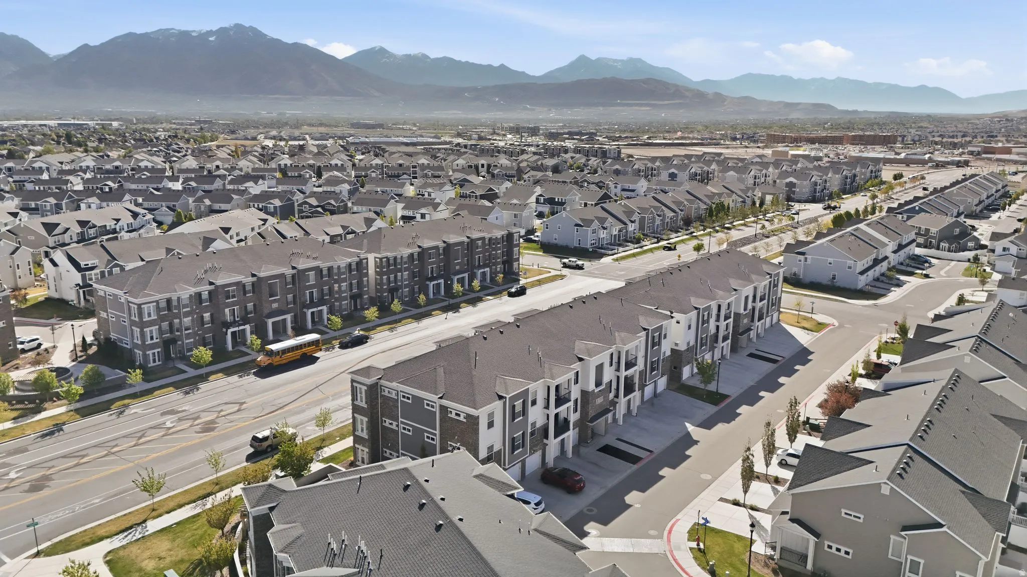 Aerial perspective of suburban area featuring a mountainous background