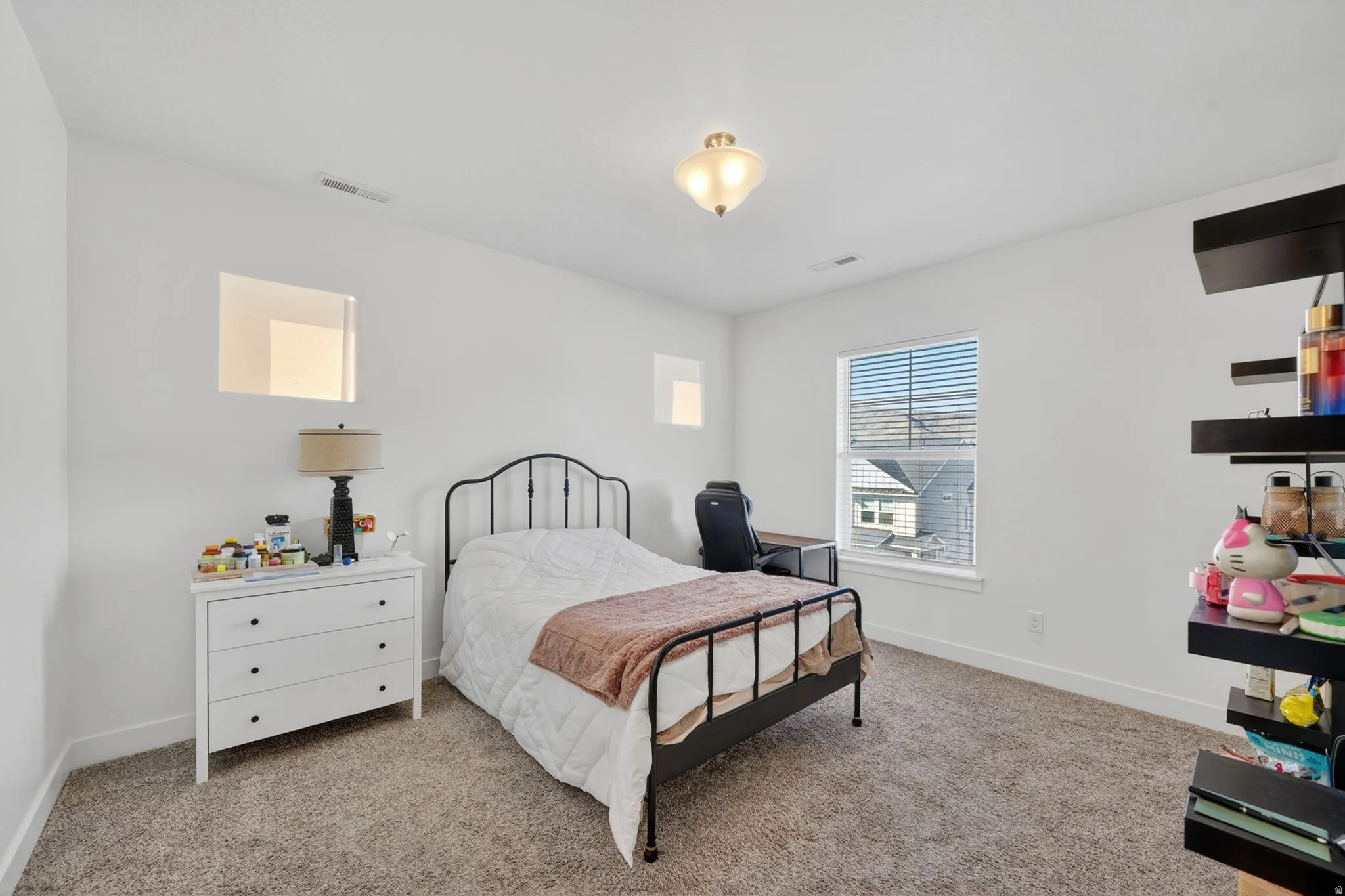 Carpeted bedroom with baseboards