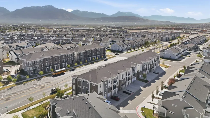 Aerial perspective of suburban area featuring a mountainous background