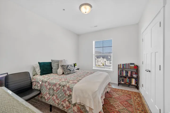 Bedroom with carpet and baseboards