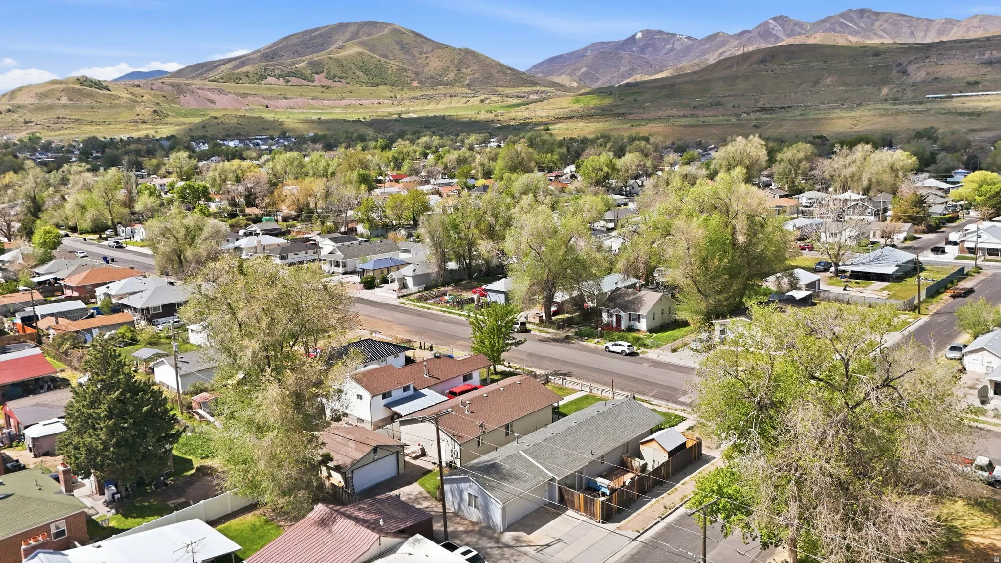 Aerial view of residential area featuring mountains
