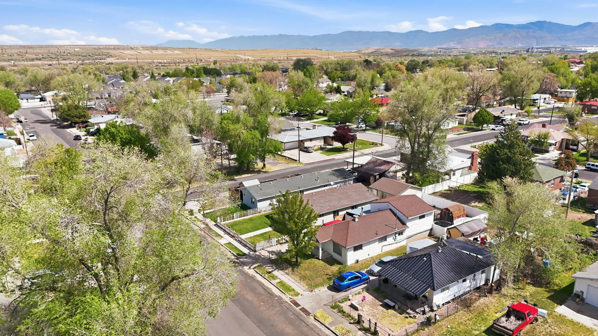 Aerial perspective of suburban area with a mountainous background