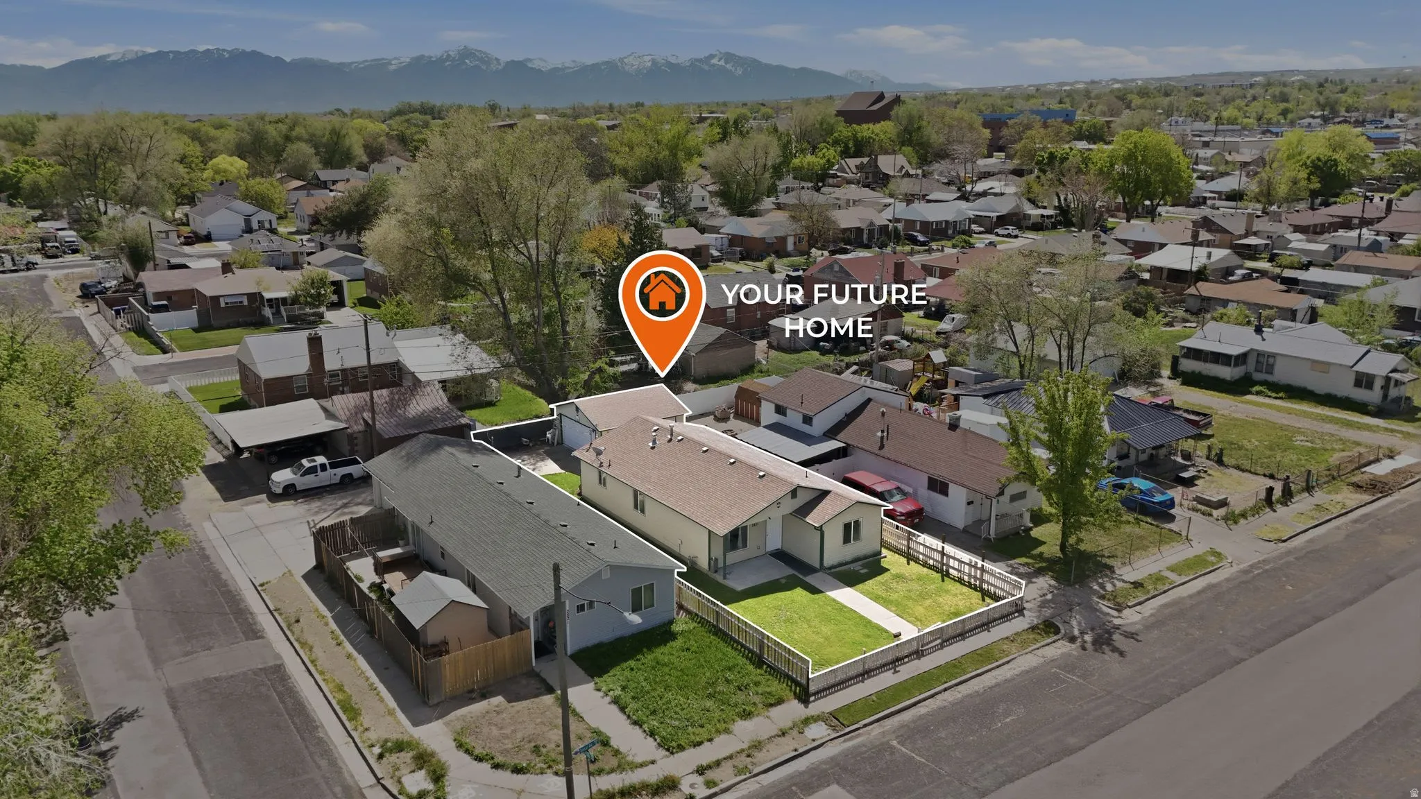 Aerial view of residential area with a mountainous background