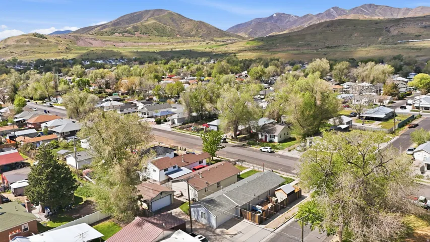 Aerial view of residential area featuring mountains