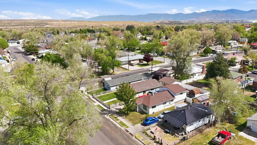 Aerial perspective of suburban area with a mountainous background