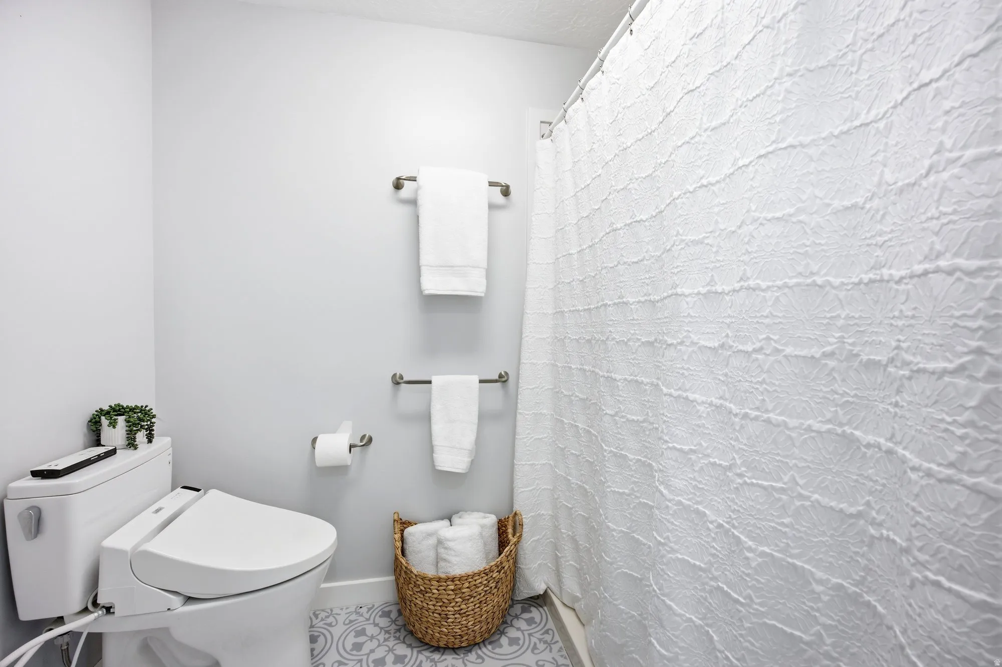 Large primary suite shower area,  featuring spa like walk in shower.