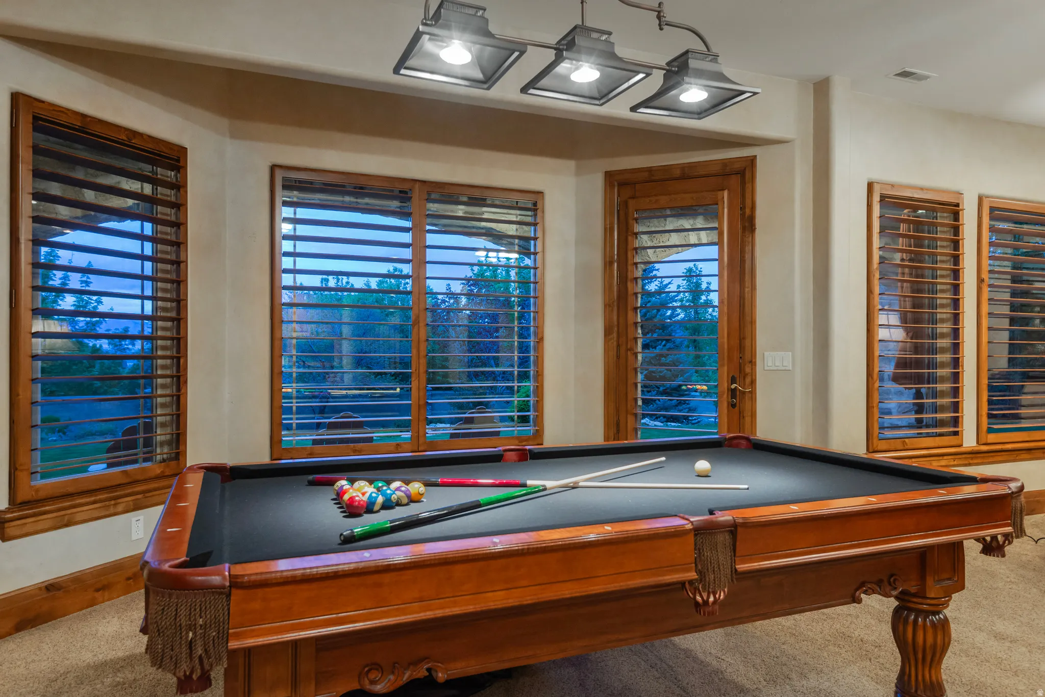 Game room featuring carpet flooring and billiards table