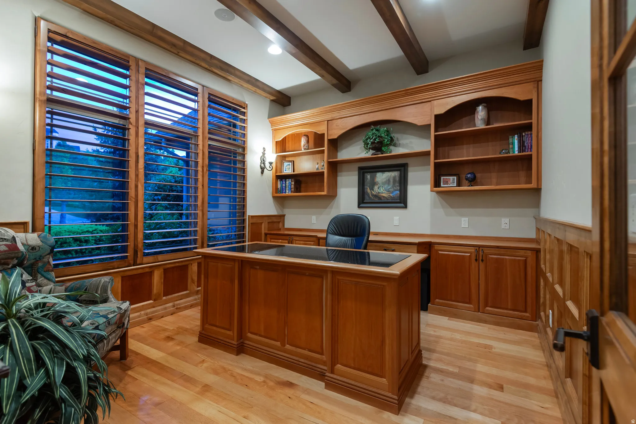 Office with a wainscoted wall, light wood-style floors, beam ceiling, wooden walls, and recessed lighting