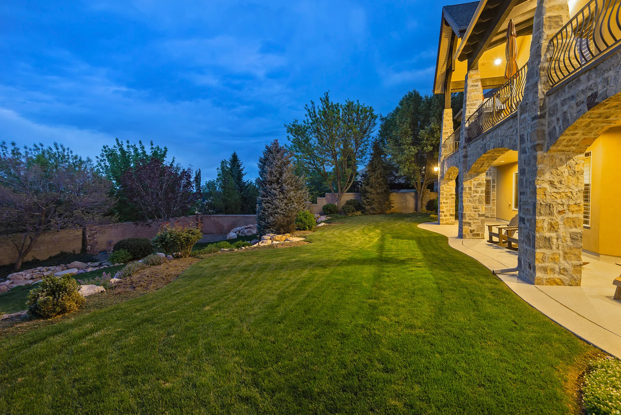 View of yard with a balcony and a patio area