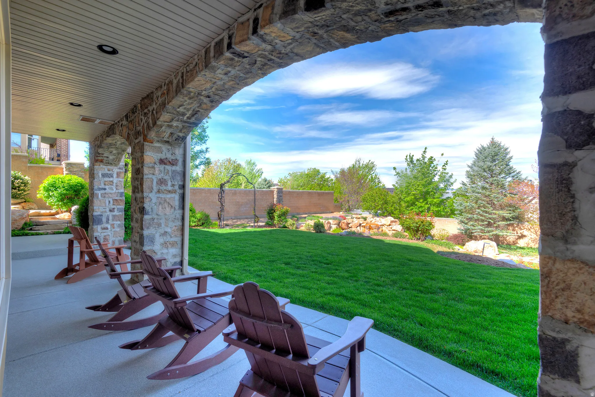 Fenced backyard with a patio area