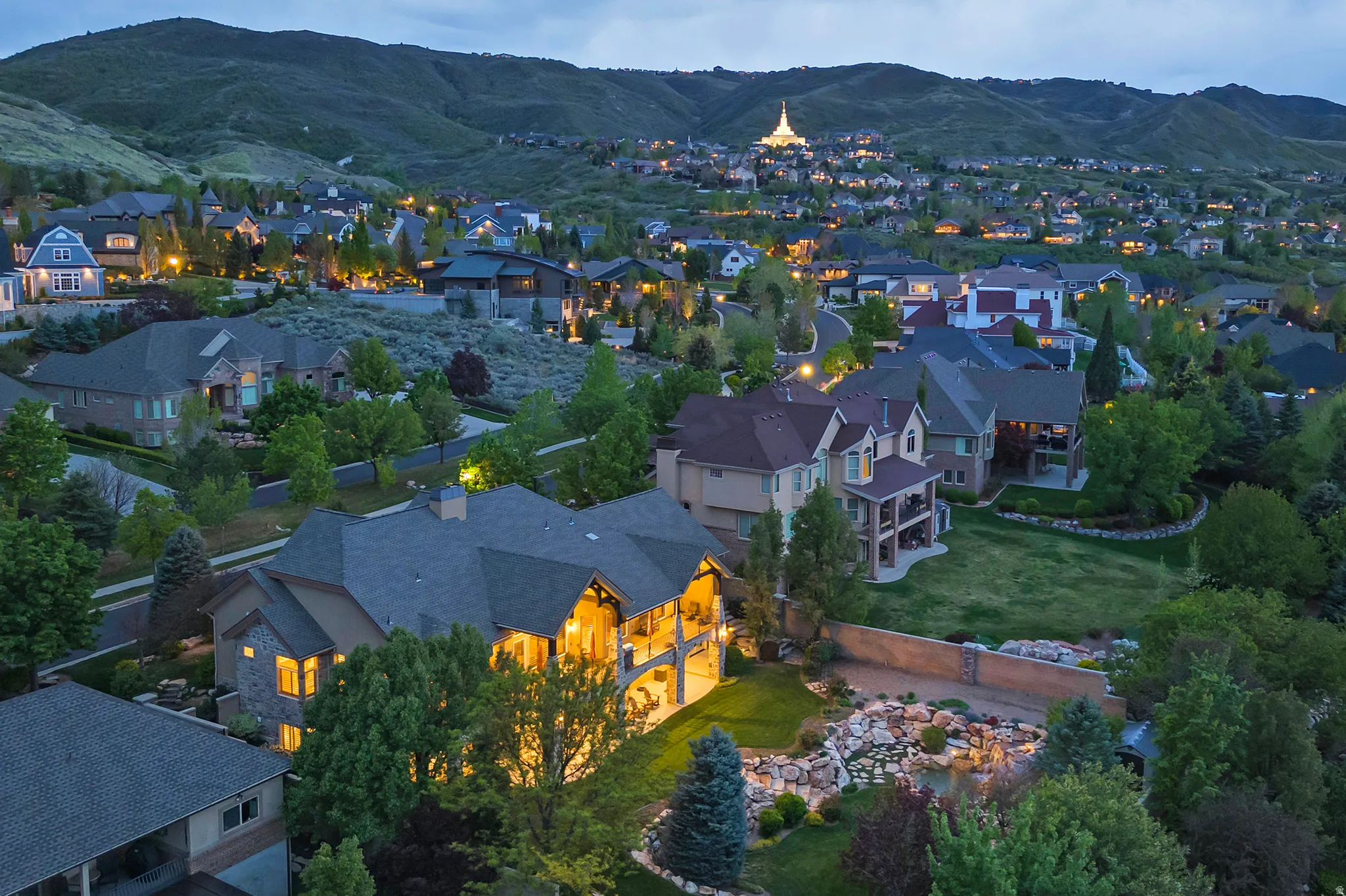 Aerial view of residential area featuring mountains