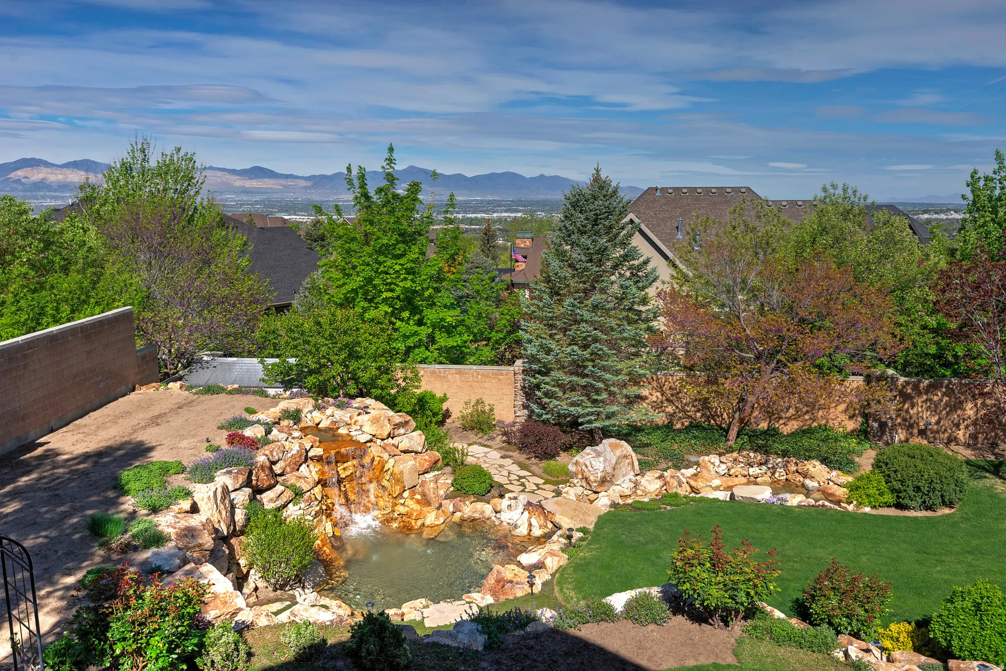 View of yard with a small pond and a mountain view