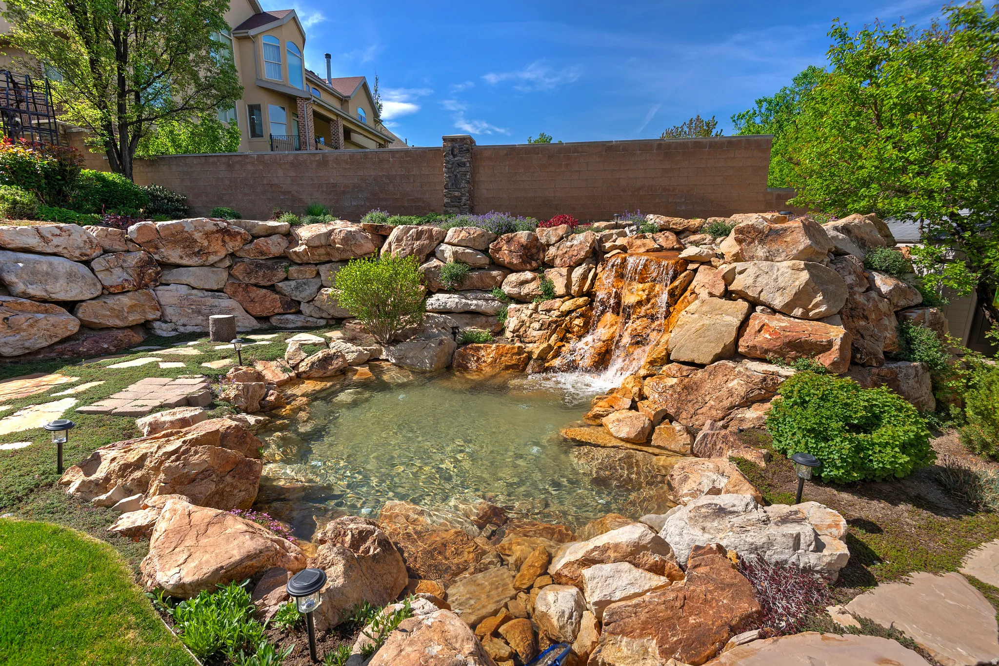 View of yard with a garden pond