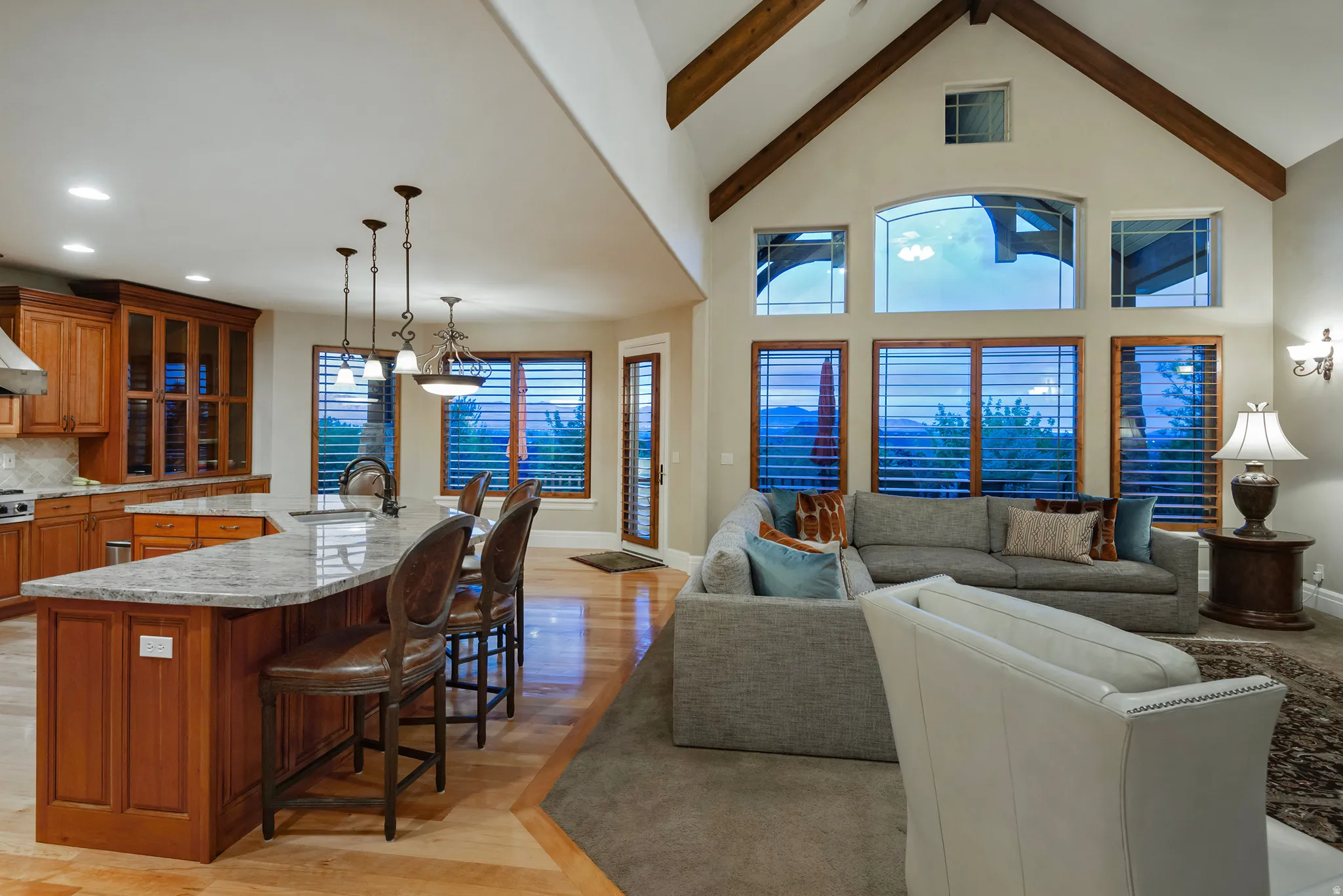 Living room featuring light wood finished floors, healthy amount of natural light, and recessed lighting