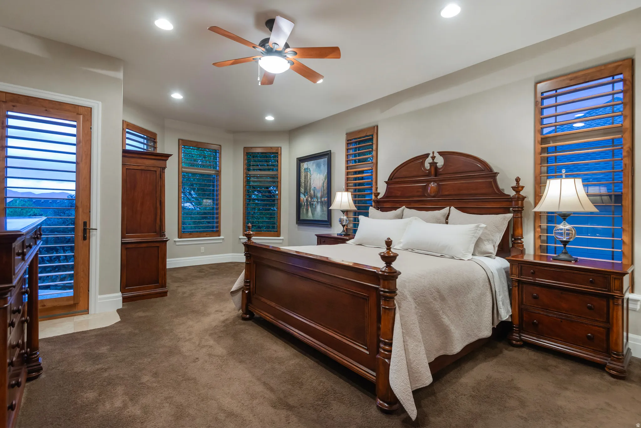 Bedroom featuring dark colored carpet, a ceiling fan, recessed lighting, and access to exterior