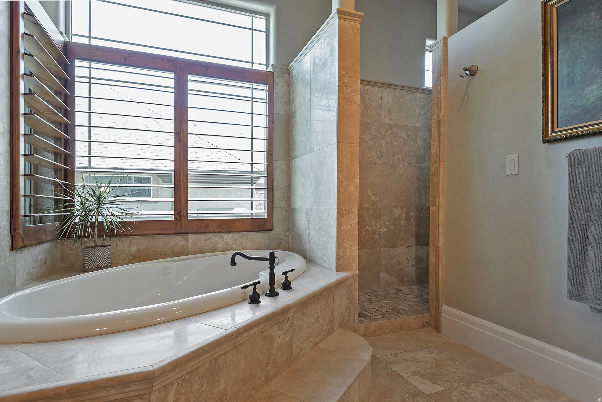 Bathroom with walk in shower and a garden tub