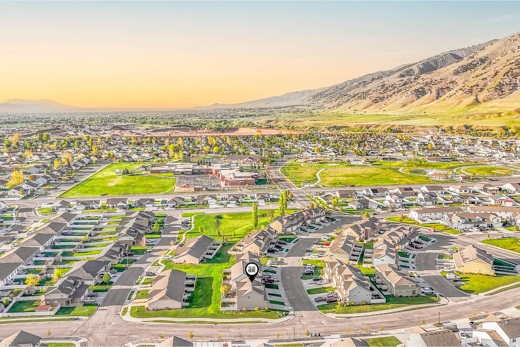 Aerial view at dusk of a mountain view and a residential view