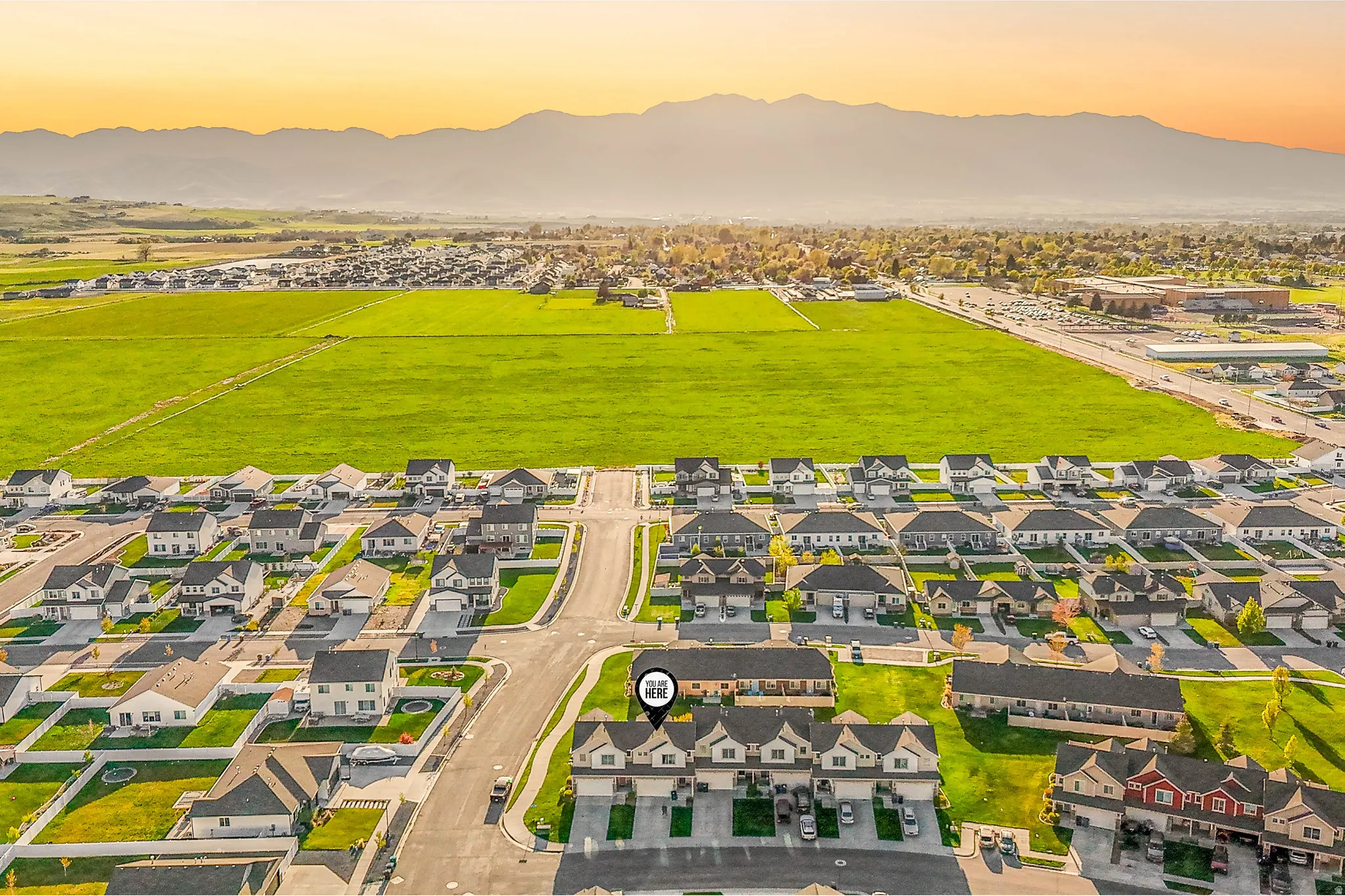 Aerial perspective of suburban area featuring mountains