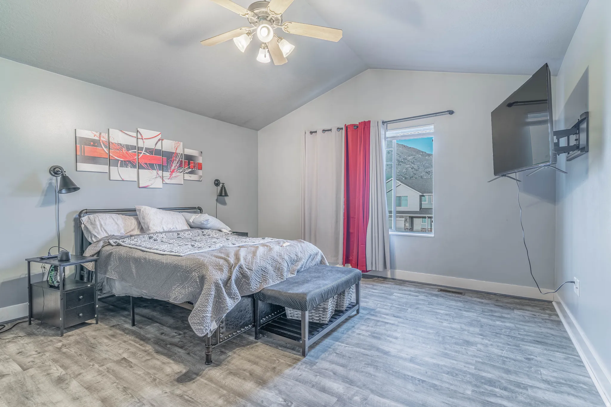 Bedroom with light wood finished floors and a ceiling fan
