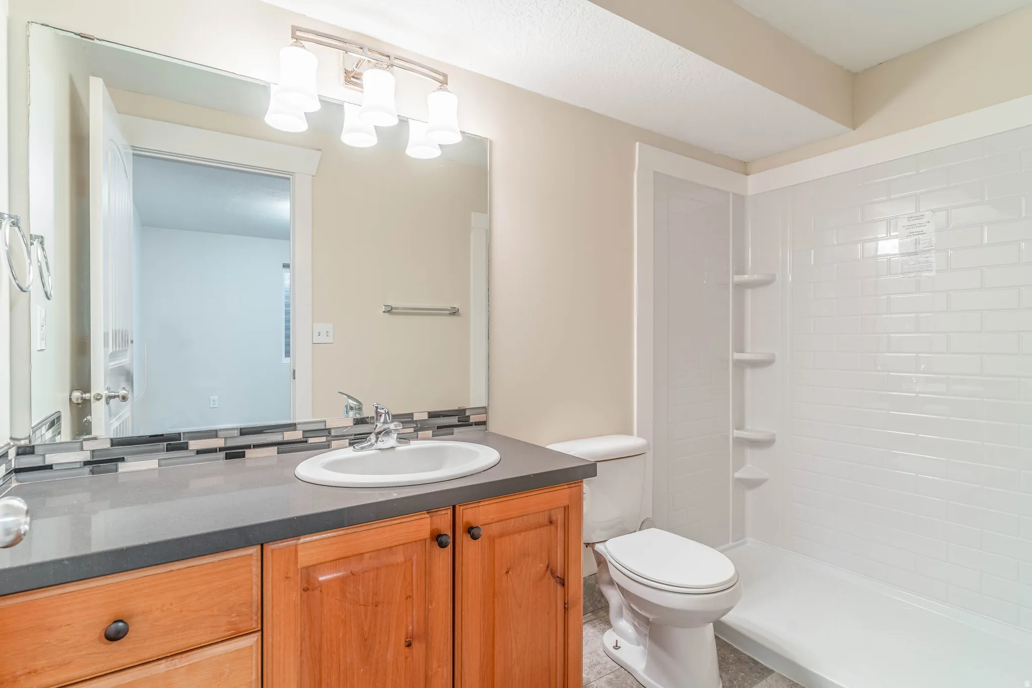 Full bathroom featuring vanity and walk in shower