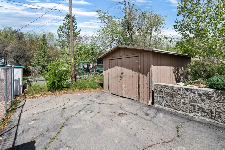 View of shed featuring view of scattered trees
